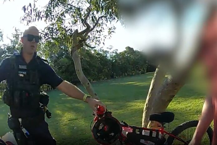 Police seizing an e-bike. Picture from QPS