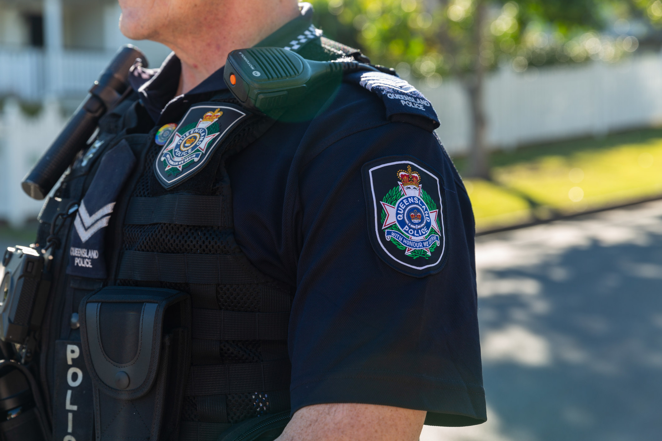 A police officer on a suburban street.