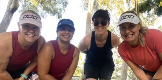 Deb Lazarenko with fellow runners smiling for the camera.