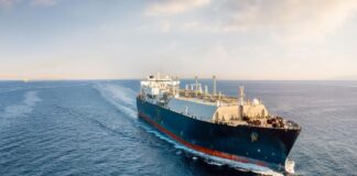 A cargo ship cruises across the ocean. Picture by Shutterstock.