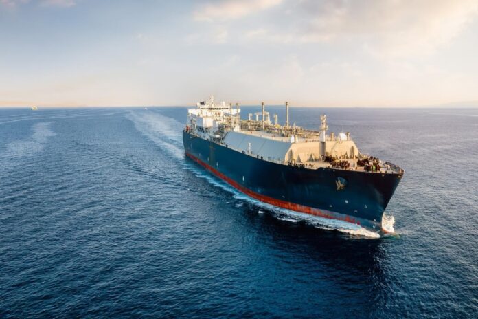A cargo ship cruises across the ocean. Picture by Shutterstock.