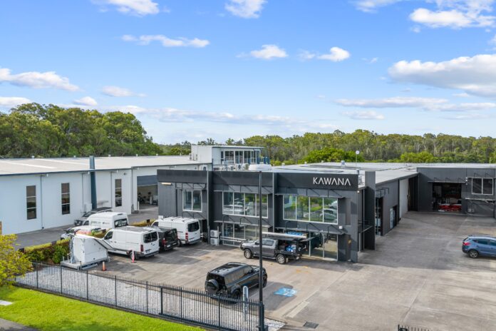 An exterior photo of a warehouse.