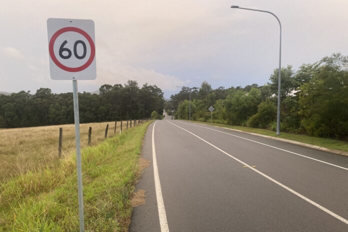 Steggalls Road stretches into the distance, with a 60kmh sign next to it in the foreground.