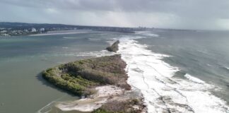 An aerial photo shows the two established breakthroughs and a third possible breakthrough at Bribie Island. Photo by Damien Lange, droner.au