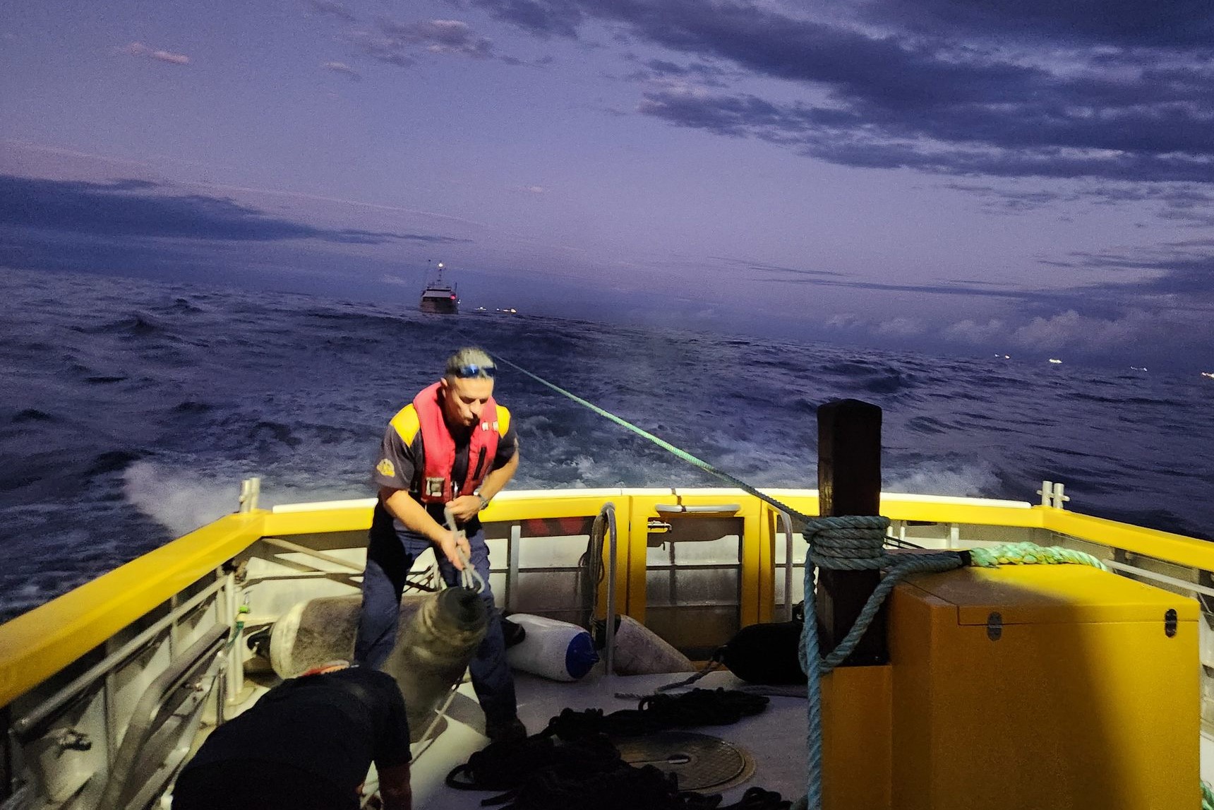 A Coast Guard Mooloolaba volunteer works on the deck of the rescue boat. Picture: Dave Weeden, Coast Guard Mooloolaba.