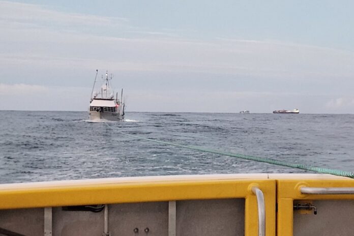The Mooloolaba Rescue boat tows a 90-tonne fishing tuna boat to shore. Picture: Dave Weeden, Coast Guard Mooloolaba.