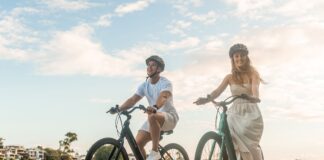 Two people riding VelectriX electric bikes.