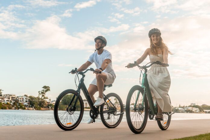 Two people riding VelectriX electric bikes.