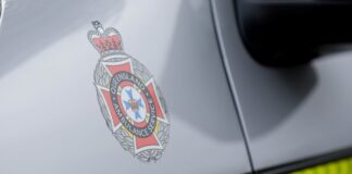 The QAS logo on the side of an ambulance. Picture by AAP.