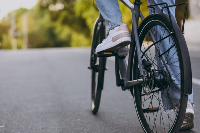 A close up of bike feet on bike wheels on a cycling path. Picture: Shutterstock.