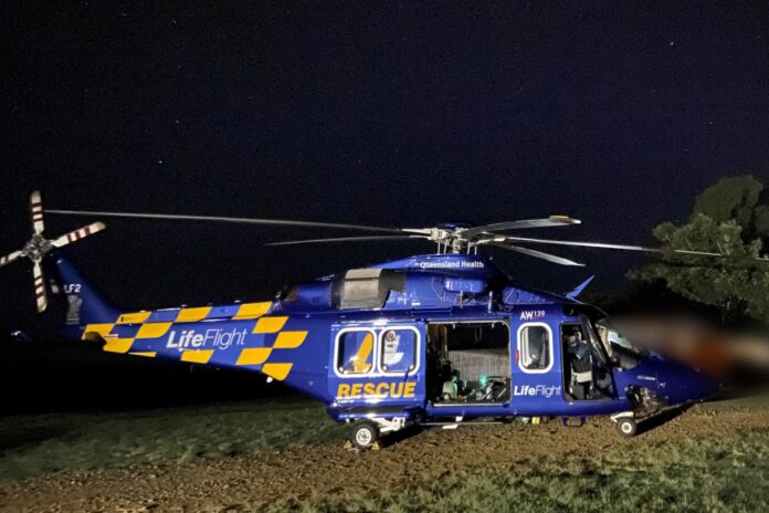 A blue LifeFlight helicopter landed on private property near the incident, at night. Picture: LifeFlight.