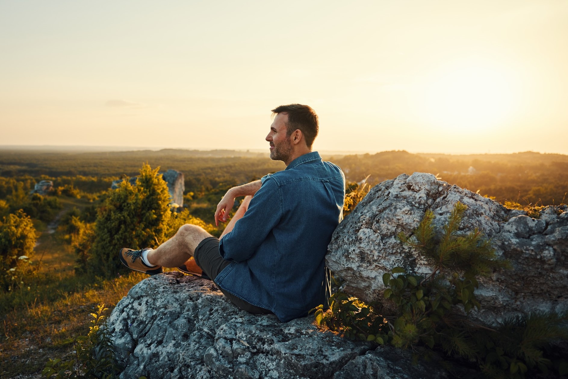 A man savours a moment alone on the beach. Picture: Shutterstock.