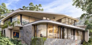 An impression of the home that could be built at 3 Allambi Rise. It shows a two-storey home with large glass windows and a pool on a slope, surrounded by trees. Picture: Shaun Lockyer Architects.