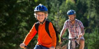 A father and his son on their bikes. Picture by Shutterstock.