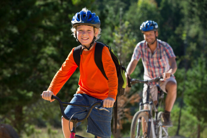 A father and his son on their bikes. Picture by Shutterstock.