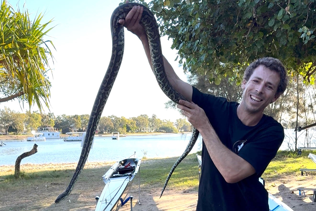 Snake catcher Dan Busstra with the python he relocated. Picture: Dan Busstra.