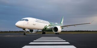 A QantasLink A220 on the runway.