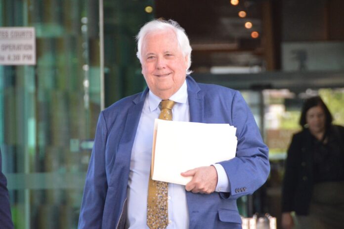 Clive Palmer leaves court in Brisbane on Friday.
