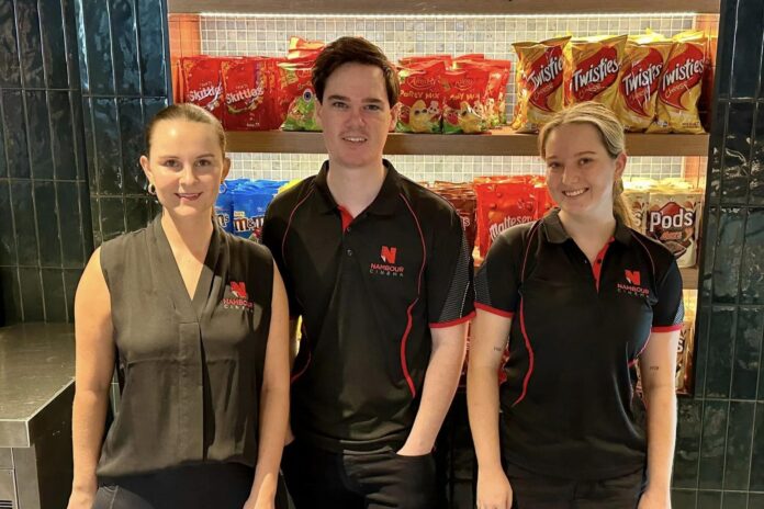 Nambour Cinema & Events Centre owner Luke Warburton, centre, with staff members Jemma and Halle.