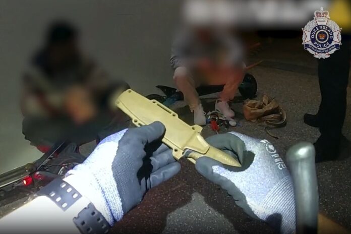 Police seizing a knife.