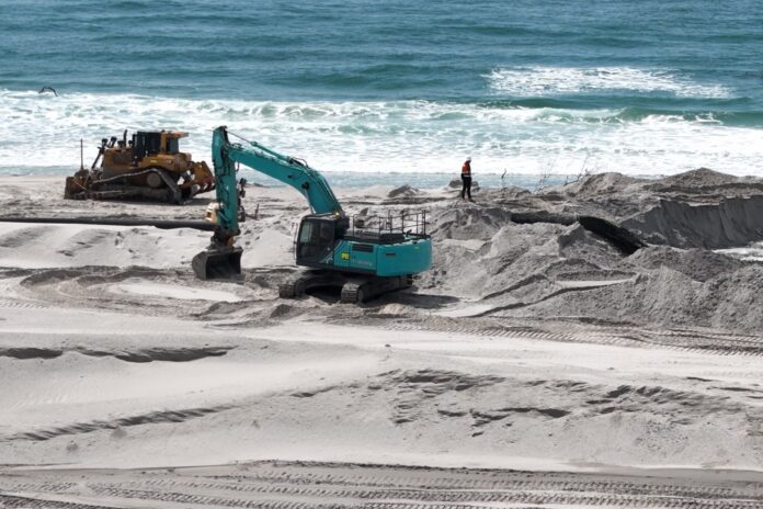 An excavator at work on Bribie Island. Picture: Damien Lange, Droner.au