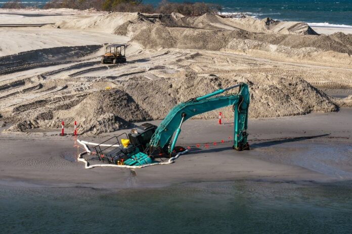 SCN271025 excavator pic bluey's photography 1 An excavator was caught in deep sand at Bribie Island. Picture: Bluey's Photography.