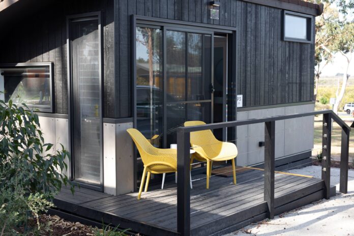 yellow outdoor chairs table setting cabin travel tiny home