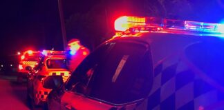 Police cars at night.