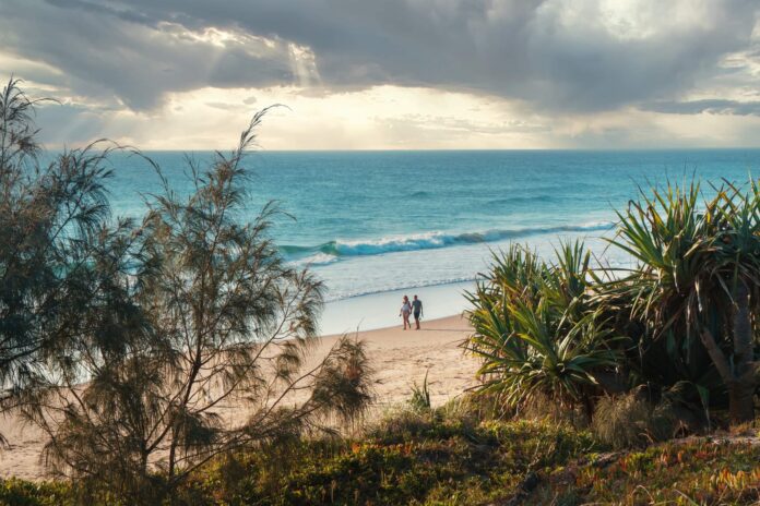 People walking on Peregian Beach. Picture: Shutterstock.