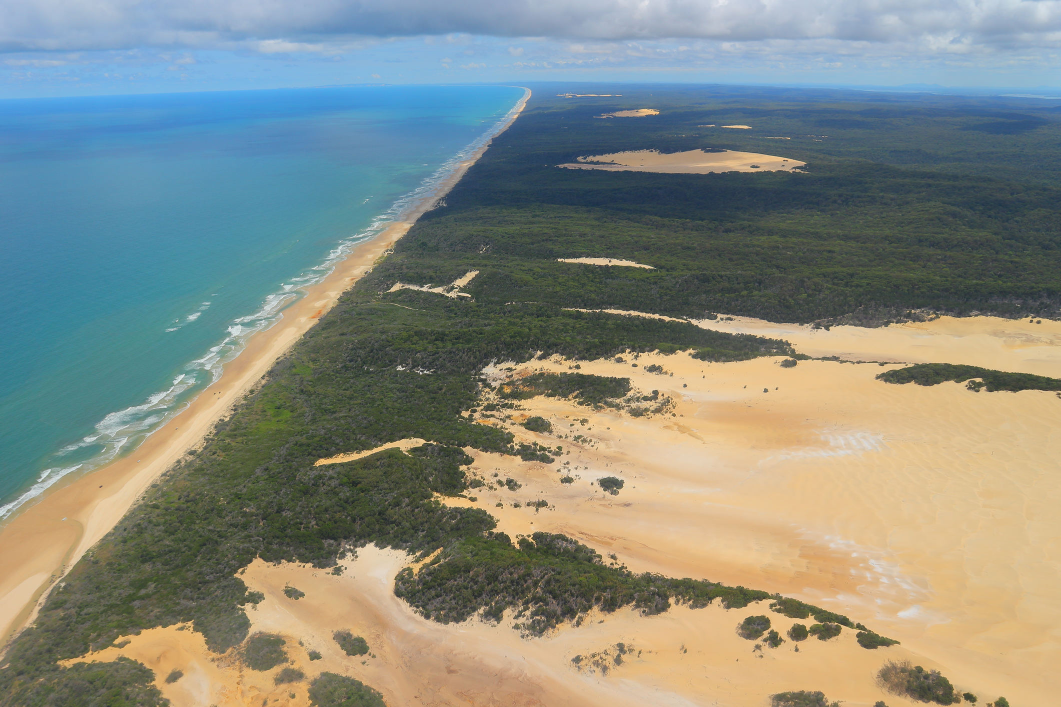An aerial view of sandy K'gari.