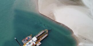A dredger collects sand from Maroochy River.