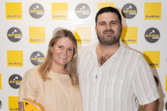 Emily and Kyle Sunderland sold a home and then bought one, at an auction event in Maroochydore.