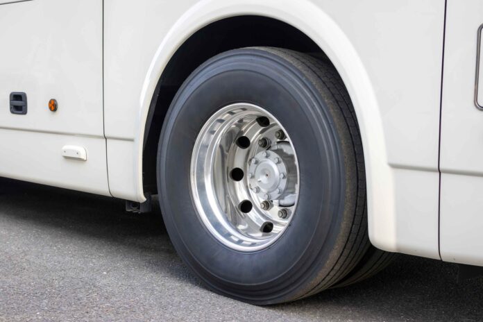 Close-up image of a large bus tyre.