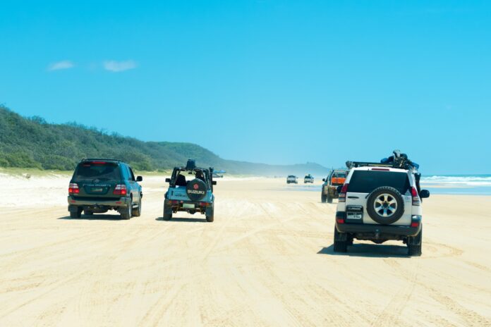 4WD vehicles on a beach.