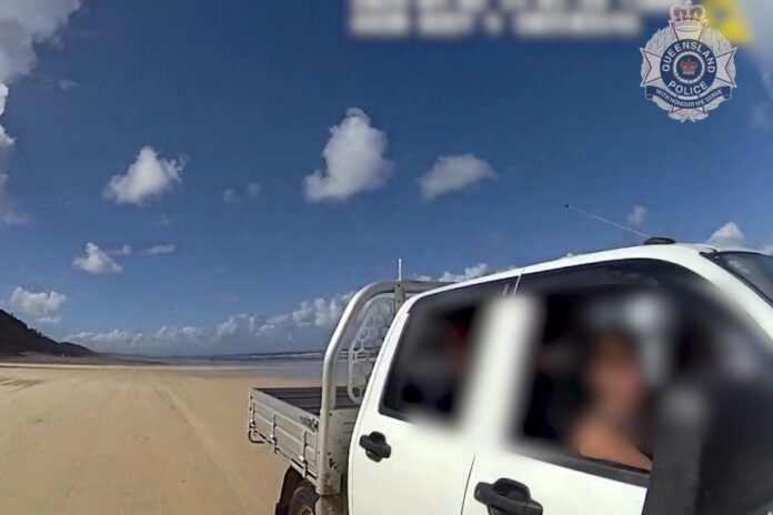 A driver is pulled over by police during the Easter long weekend. Picture: QPS.