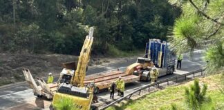 This excavator was removed from the highway after it hit a bridge and came off a truck. Picture: Benny Hodge.