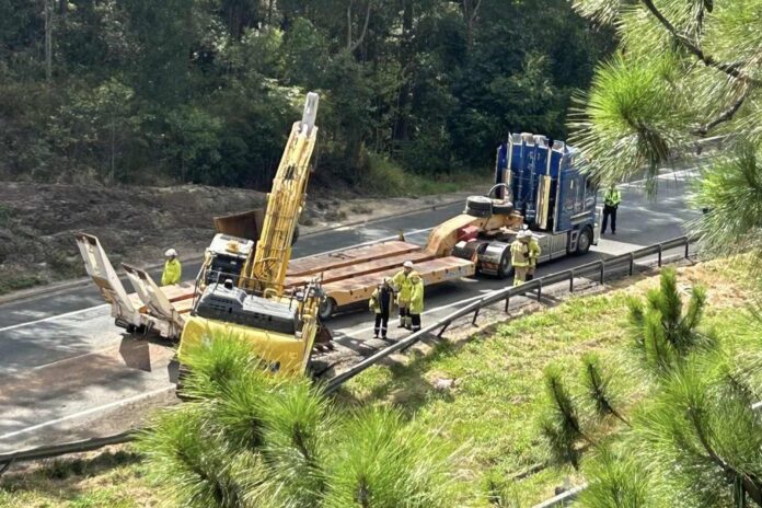 This excavator was removed from the highway after it hit a bridge and came off a truck. Picture: Benny Hodge.