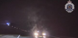 Footage shows a vehicle driving on the wrong side of the road and almost into the path of police. Picture: QPS.