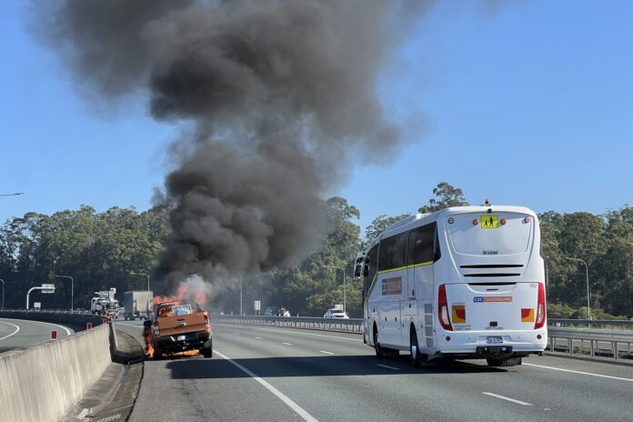 Smoke billows from the vehicle. Picture: Ben Beaden.