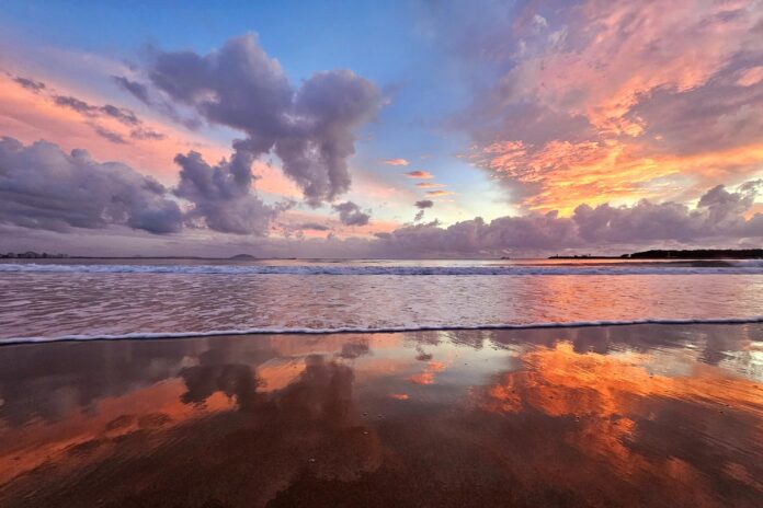 Photo of the day Photographer Helen Browne captured the rich hues of dawn magnificently reflected in the sand at Mooloolaba Beach