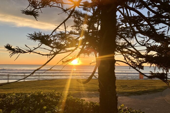 Photo of the day photographer Margaret Conwell captures the rising sun at Alex Beach