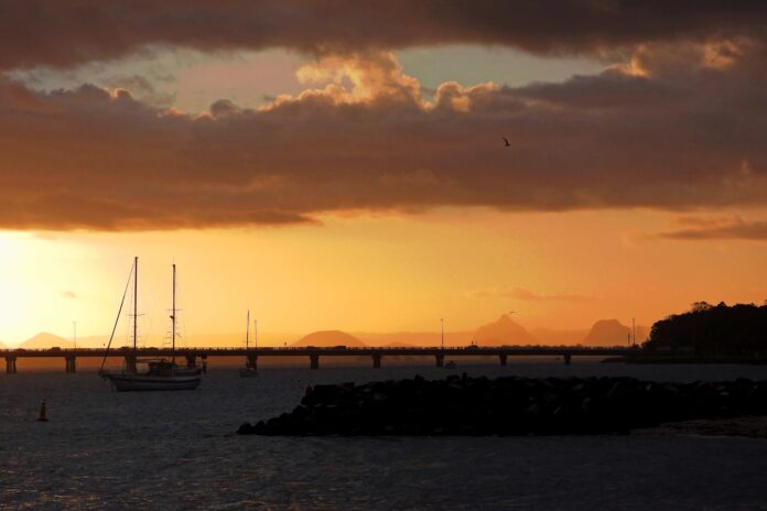 Photo of the day Sandy Gillis took this photo from Bribie Island looking towards the Glass House Mountains at sunset