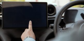 A driver using a touchscreen.