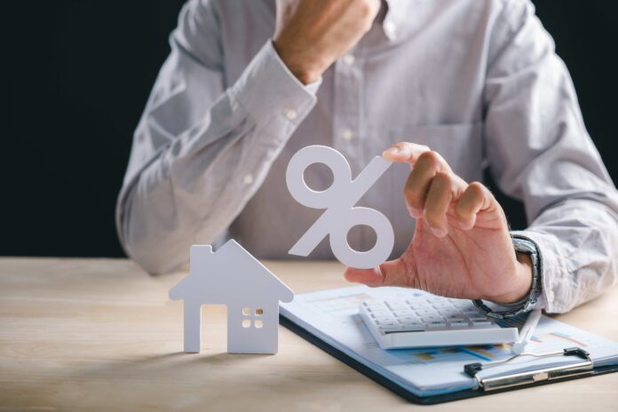 Picture illustrating an individual assessing how the 2026 federal budget changes to capital gains tax and negative gearing will impact him