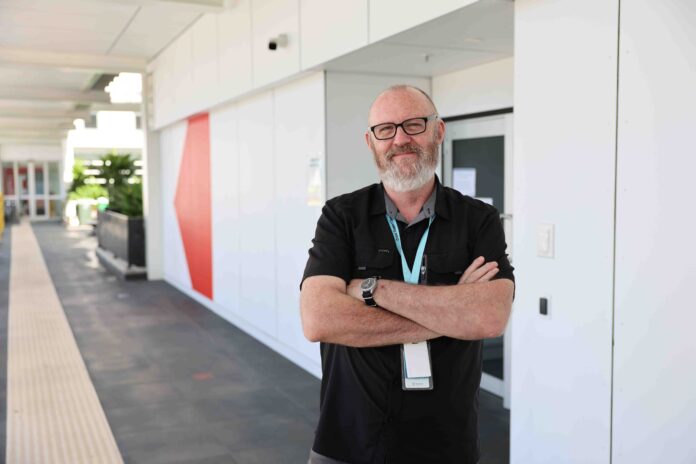 Advanced peer worker Robert Stanley in front of the new mental health crisis support space.