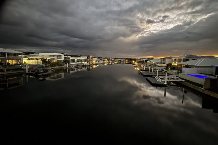 Photographer Tom Regener storm over Pelican Waters