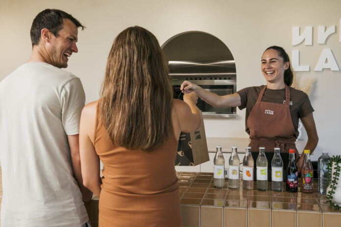 Urban Lamb co-founder Katrina Dickens serving a customer at the Buddina store.