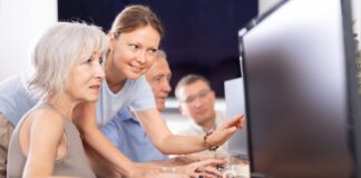 Elderly people receiving computer training. Picture from Shutterstock