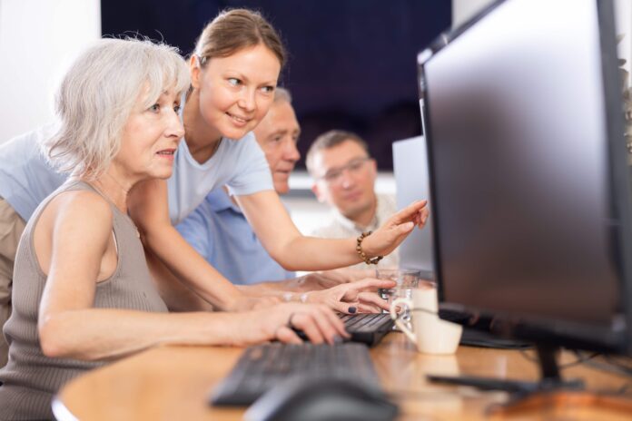 Elderly people receiving computer training. Picture from Shutterstock