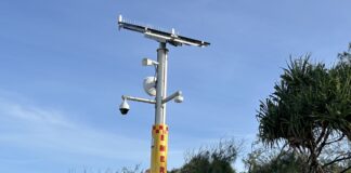An emergency response beacon near the mouth of Stumers Creek at Coolum Beach.
